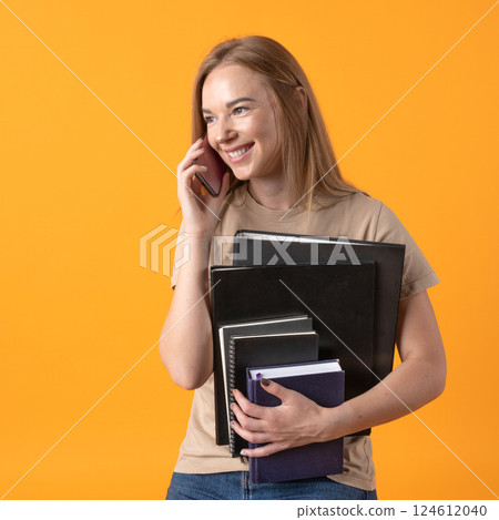Multitasking Young Woman on a Call 124612040