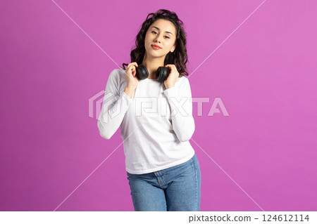 Beautiful woman listening music with headphones 124612114