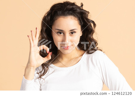 Woman showing OK hand gesture 124612120