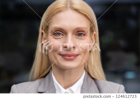 Headshot of a blonde cute caucasian smiling woman 124612723