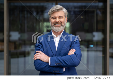 Bearded mature elegant man looking contented and smiling 124612733