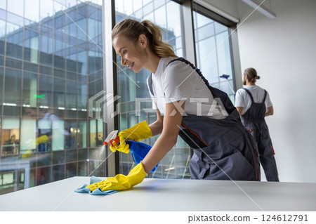 Group of young doing cleaning works in the office Group of young doing cleaning works in the office 124612791