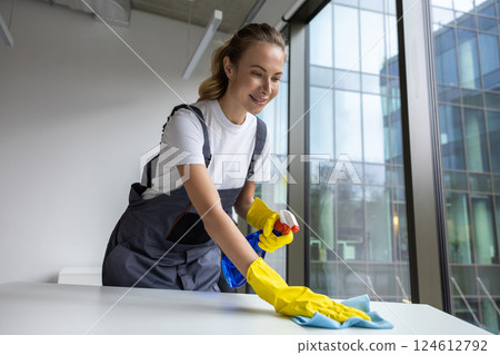 Group of young doing cleaning works in the office 124612792