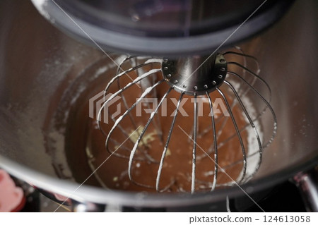 the close-up dough making in stainless steel bowl. food processor to kneading gingerbread 124613058