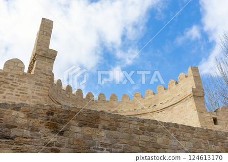 Historic stone fortification wall with crenellations. Baku Historic stone fortification wall with crenellations. Baku 124613170