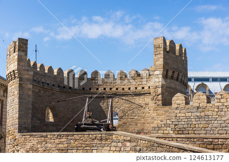 Historic fortress wall featuring a medieval catapult, Baku 124613177
