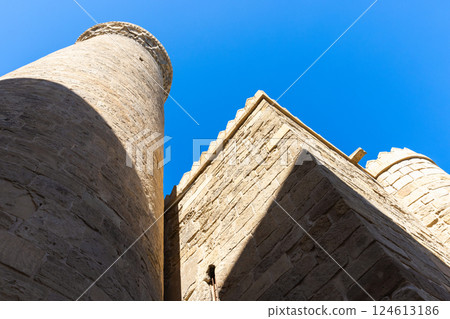 Baku old town steet view with walls and minaret of the Muhammad Mosque 124613186