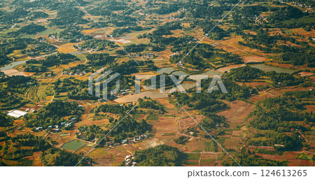 View From Airplane Window On Surroundings Of Chengdu, China. Development Of Agriculture In China. Wooded Terrain Landscape Of China. Porthole View Or Called Bull's-eye Window On Rice Fields. Discover 124613265
