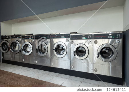 Laundry service shop with automatic washer and dryer Laundry service shop with automatic washer and dryer 124613411