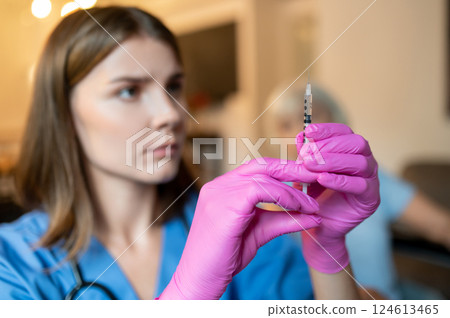 Elderly woman receive professional medical care during visit in private clinic Elderly woman receive professional medical care during visit in private clinic 124613465