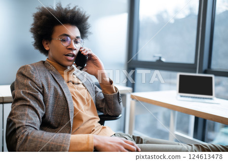 Entrepreneur working in the office using smartphone to communicate 124613478