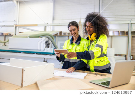 Professional product manager staff worker team working in wood furniture factory with safety suit 124613997