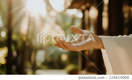 Hand of Jesus reaching out with light in spiritual scene, copy space background 124614000