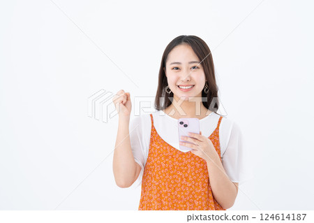 A young woman using a smartphone A young woman using a smartphone 124614187
