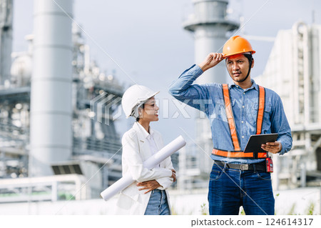 Professional Petroleum Refinery engineer team working building oil and gas power industrial plant. 124614317