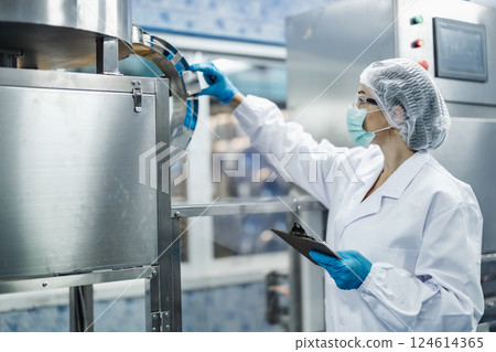 Industry inspector team working, QC staff work checking machine operation for safety and hygiene Industry inspector team working, QC staff work checking machine operation for safety and hygiene 124614365