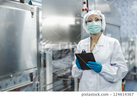 Industry inspector team working, QC staff work checking machine operation for safety and hygiene 124614367