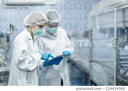 Industry inspector team working, QC staff work checking machine operation for safety and hygiene 124614368