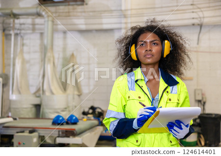 African black women worker working in wood workshop wooden furniture warehouse factory industry 124614401