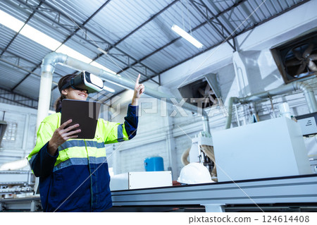 Modern Factory Innovation Technology in Industry, Technician using VR Virtual Reality Headset Modern Factory Innovation Technology in Industry, Technician using VR Virtual Reality Headset 124614408