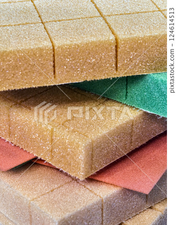 Close-up view of colorful foam rubber sheets stacked in layers for crafting and design projects 124614513