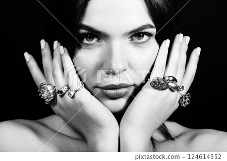 Close-up studio portrait of beautiful woman with fancy various rings on her hands Close-up studio portrait of beautiful woman with fancy various rings on her hands 124614552