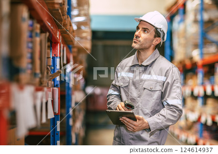 Warehouse worker working check inventory at shelf with barcode scan, Cargo employee staff in duty 124614937