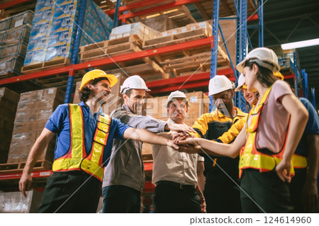 Group of worker in warehouse team join hands together in cargo building happy smile 124614960