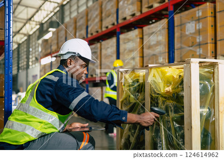 african black professional warehouse worker. stock inventory staff employee working in cargo storage african black professional warehouse worker. stock inventory staff employee working in cargo storage 124614962