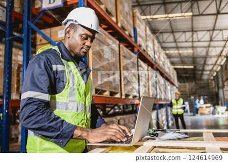 african black professional warehouse worker. stock inventory staff using computer check stock online african black professional warehouse worker. stock inventory staff using computer check stock online 124614969