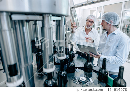 professional engineer technician man service check machine in drink factory for quality standard 124614978