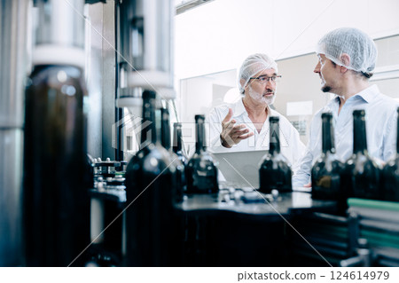 professional engineer technician man service check machine in drink factory for quality standard professional engineer technician man service check machine in drink factory for quality standard 124614979