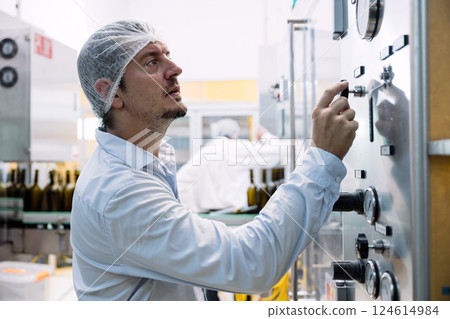 professional engineer technician man service check machine in drink factory for quality standard professional engineer technician man service check machine in drink factory for quality standard 124614984