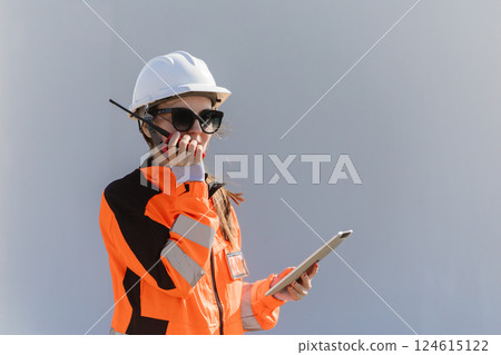 Engineer technician worker checking service maintenance wind turbine clean electricity power station 124615122