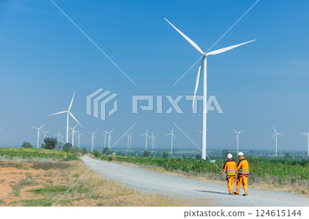 Engineer workers teamwork working together service maintenance wind turbine clean power green energy 124615144