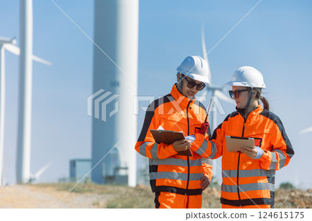Engineer workers teamwork working together service maintenance wind turbine clean power green energy Engineer workers teamwork working together service maintenance wind turbine clean power green energy 124615175