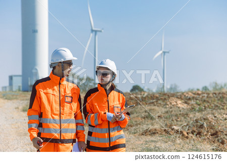 Engineer workers teamwork working together service maintenance wind turbine clean power green energy Engineer workers teamwork working together service maintenance wind turbine clean power green energy 124615176