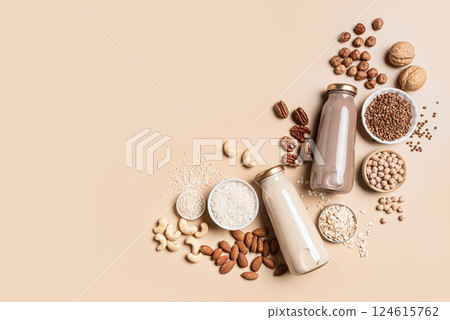 Two bottles of  vegan plant based milk and ingredients 124615762