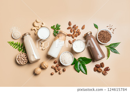 Vegan plant based milk bottles and ingredients. Substitute drink Vegan plant based milk bottles and ingredients. Substitute drink 124615784