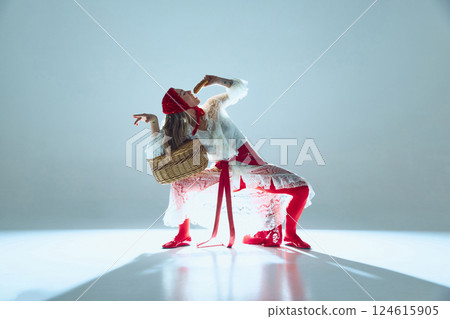 Woman twisting in fluid motion, lace dress swirling, gaze piercing, symbolizing subconscious expression, breaking free from constraints. 124615905