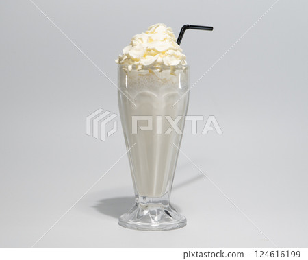 Delicious Vanilla Milkshake with Whipped Cream in a Glass with Straw Delicious Vanilla Milkshake with Whipped Cream in a Glass with Straw 124616199