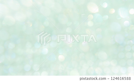 具有重疊模糊燈光的綠色背景材料。閃閃發光、柔和的散景。美麗的。 124616588