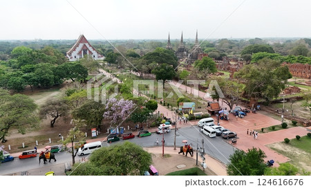 Tourists ride an elephant through the streets of Ayutthaya cultural. 124616676