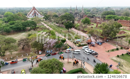 Tourists ride an elephant through the streets of Ayutthaya cultural. 124616678