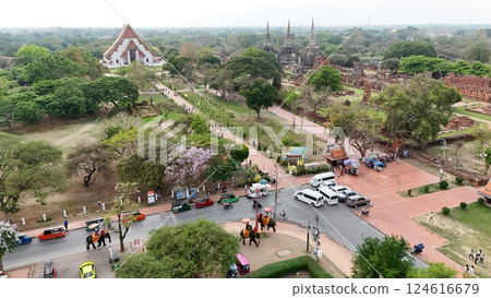 Tourists ride an elephant through the streets of Ayutthaya cultural. 124616679