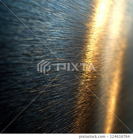 The warm light reflecting on the brushed metal creates an abstract and industrial texture. The warm light reflecting on the brushed metal creates an abstract and industrial texture. 124616764