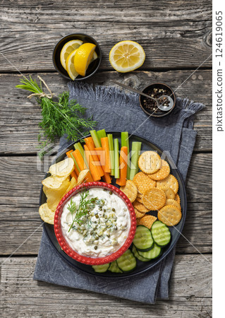 creamy yogurt pickles caper dill dip in red bowl creamy yogurt pickles caper dill dip in red bowl 124619065