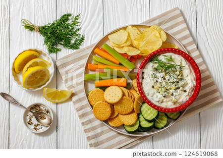 creamy yogurt pickles caper dill dip in red bowl creamy yogurt pickles caper dill dip in red bowl 124619068