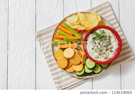 creamy yogurt pickles caper dill dip in red bowl 124619069