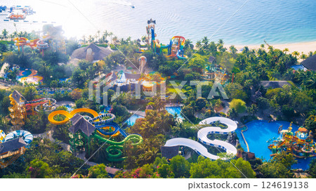 aquapark with slides and a swimming pool at resort. Entertainment park with water park by sea on VinPearl in Nha Trang in Vietnam aerial top view from drone 124619138